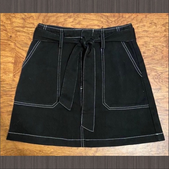 black denim skirt with white stitching